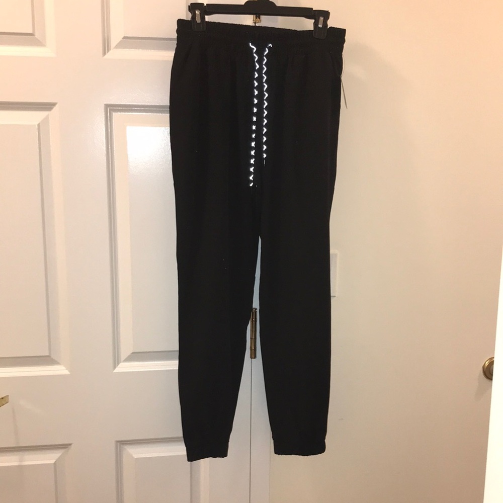 NWT Boutique Ardine Black Move Track Pants. Features Four way stretch Dry-Fit.